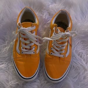 Orange & white vans.